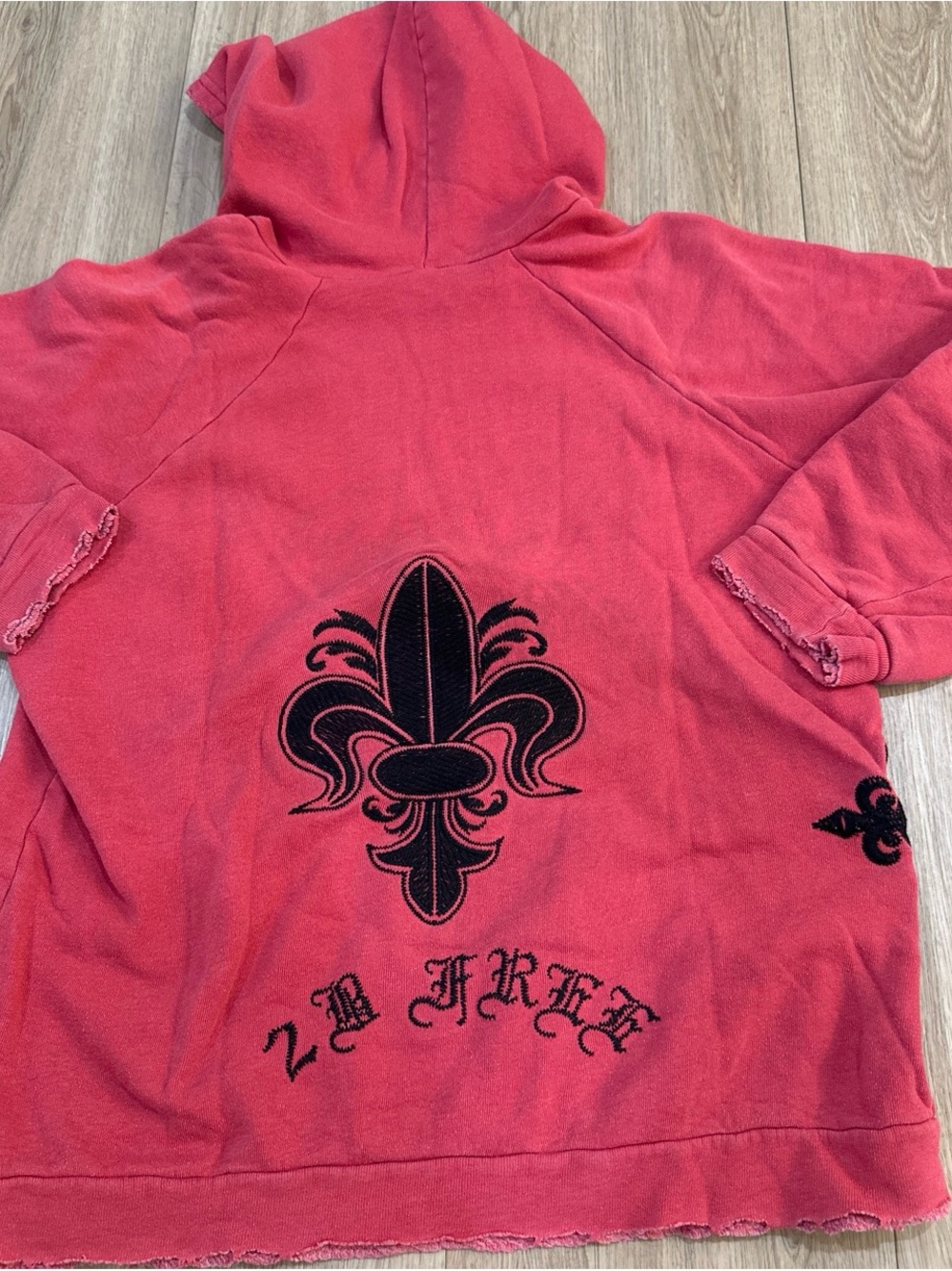 Red Hoodie with Black Fleur-de-Lis Graphic